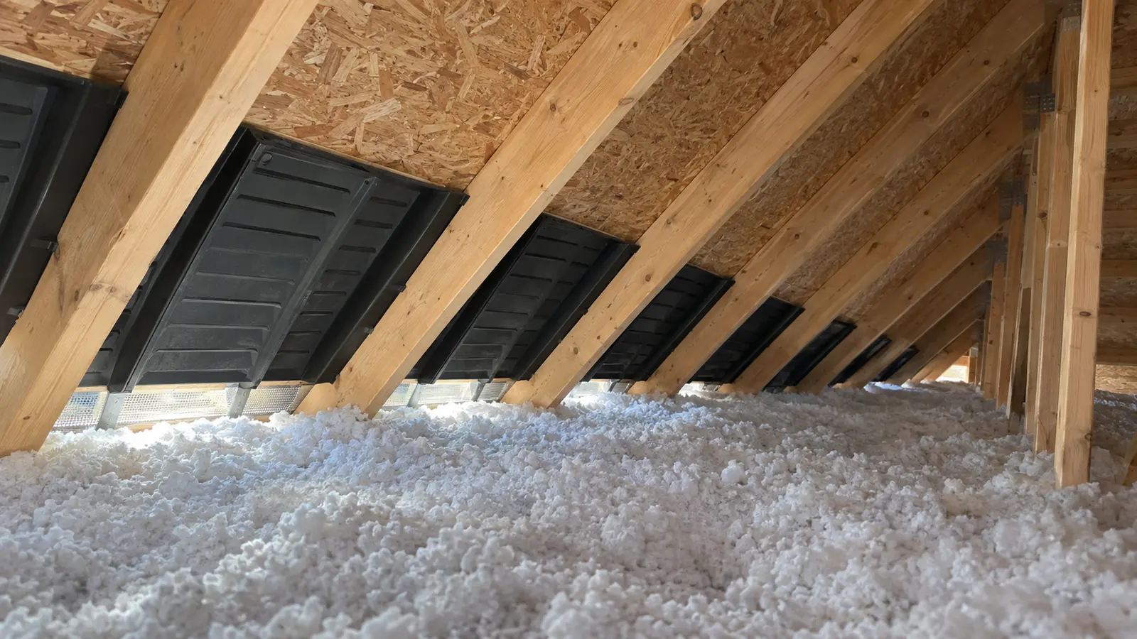 Baffles maintaining an open path above the soffits.