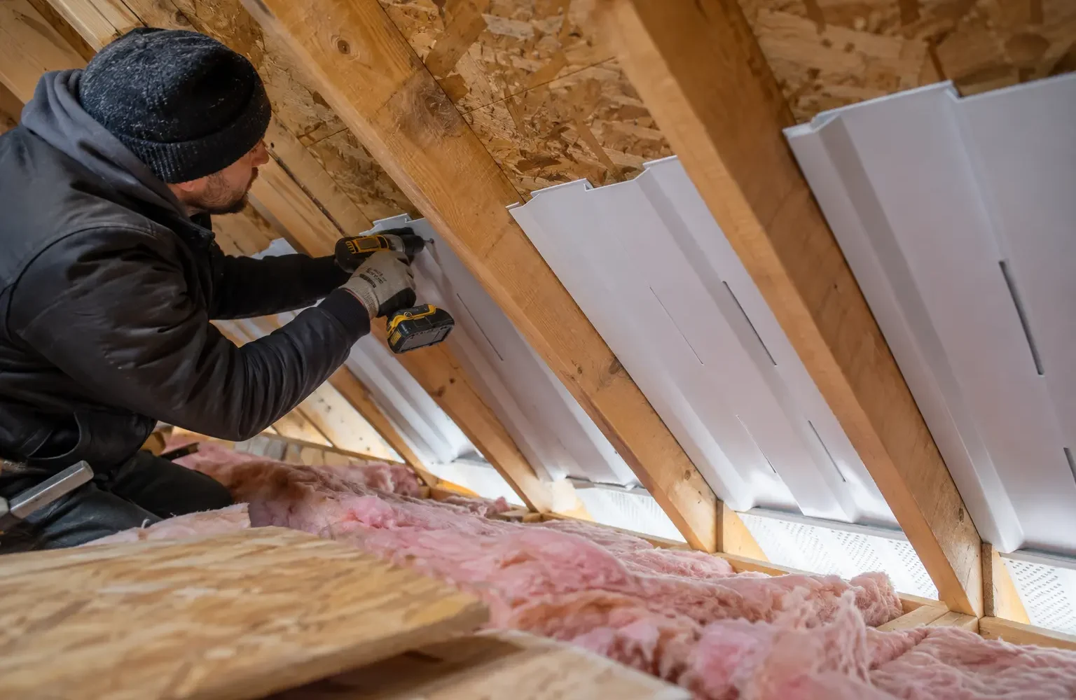 Ventilation baffles fitted between rafters above the eaves